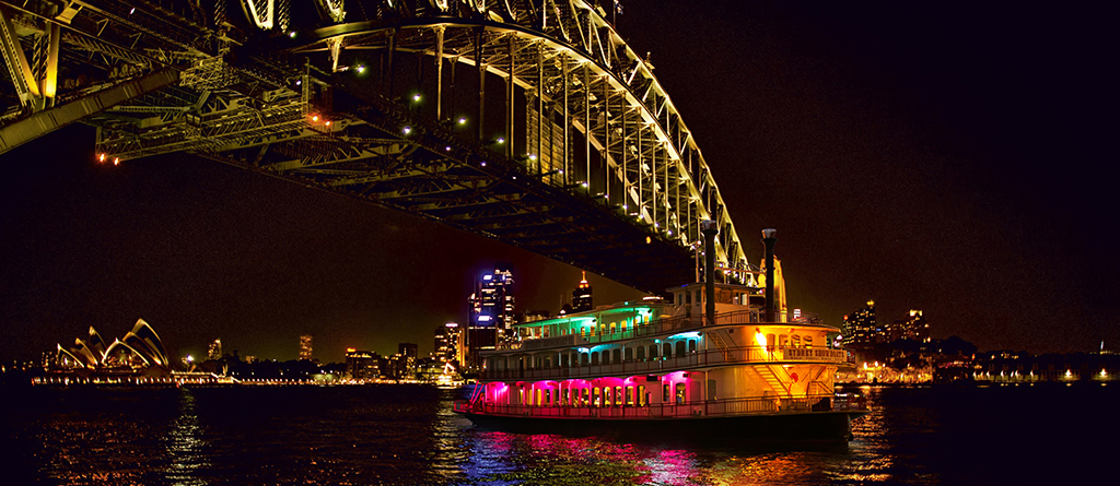 The Showboat Christmas party dinner cruise gliding past the Harbour Bridge