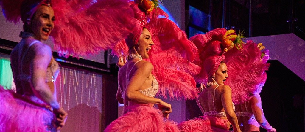 A live cabaret show unfolding on the Showboat dinner cruise