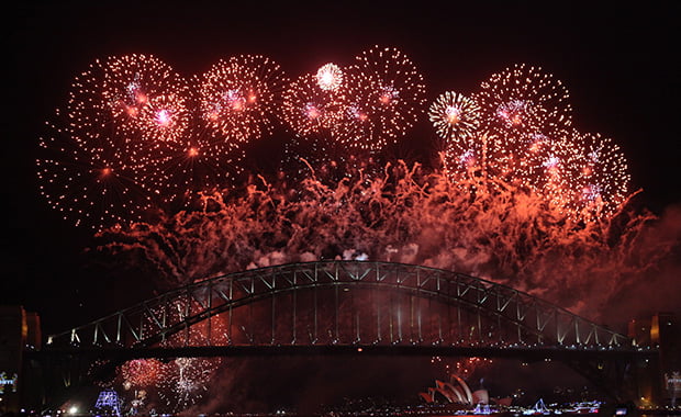 A shimmering canvas of colours bursts in the night sky on New Year's Eve as seen from Sydney Showboat.