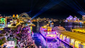 Illuminated Vivid Sydney Showboat cruising through Sydney Harbour during Vivid Sydney